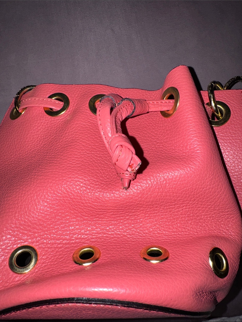 Coral Pink Leather Drawstring Shoulder Bag with Gold Grommets
